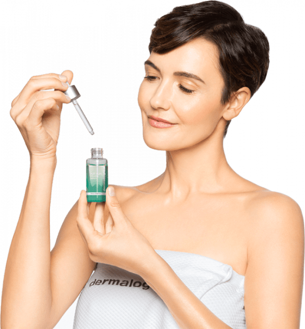 gaby_holding_dropper_and_bright_clearing_serum_on_white_2