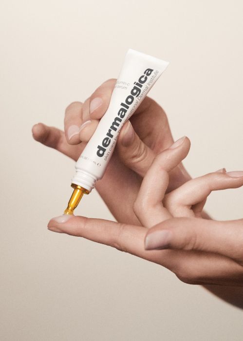 launch_-_model_female_1_applying_product_to_finger_2_-_biolumin-c_eye_serum